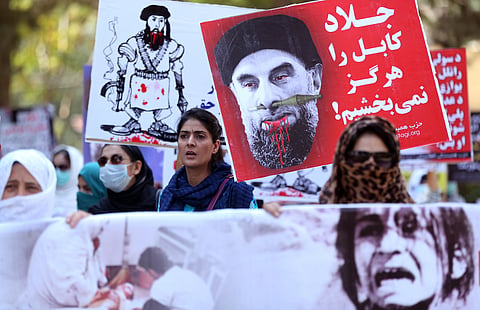 Afghan demonstrators shout slogans against Gulbuddin Hekmatya, the leader of Hizb-i-Islami Gulbuddin party, during a demonstration in a public park in Kabul, Afghanistan. | AP