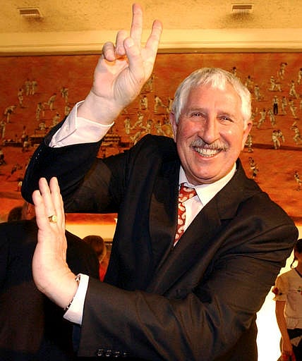 In this Sept. 23, 2003 photo, former Australian Rules footballer and test cricketer Max Walker demonstrates his trademark bowling action. (File | AP)