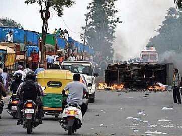 A torched vehicle during the Cauvery protest