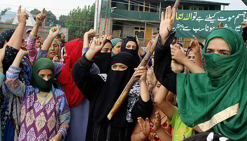 Women shout slogans during a protest against the killing of civilians in Srinagar on Tuesday. (PTI) 