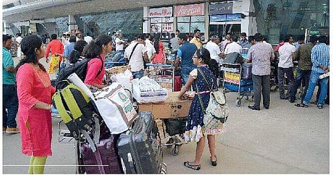 Passengers stranded at the Tiruchy International Airport after Air India Express flights to Sharjah and Dubai were delayed on Saturday | M k ashok kumar