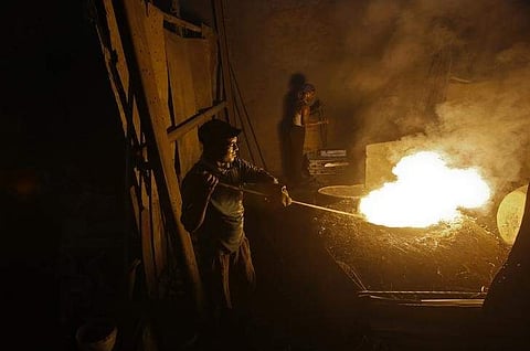 Labourers work inside an aluminium smelting factory in Mumbai March 12, 2013. (File | REUTERS)