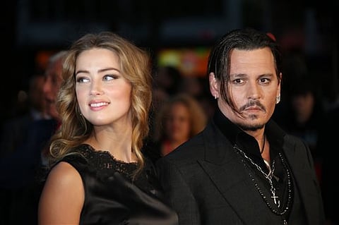 Hollywood actress Amber Heard (L) with actor spouse Johnny Depp. (File Photo | AP)