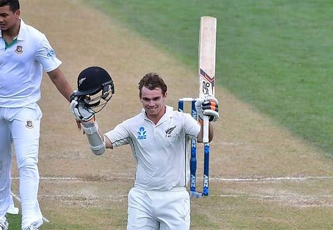 New Zealand's Tom Latham celebrate 100 runs during day three of the first international Test cricket match between New Zealand and Bangladesh at the Basin Reserve in Wellington. | AFP