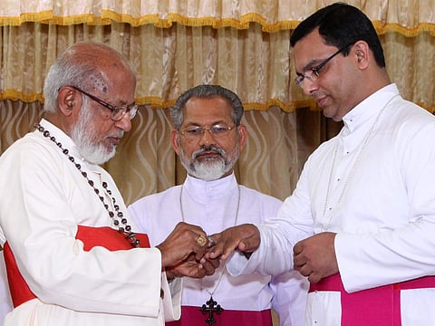 Syro Malabar Church head Mar George Cardinal Alencherry presenting   bishop-elect Fr Thomas Tharayil  with the insignia of episcopacy. Archbishop of Changanassery Mar Joseph Perumthottam looks on, at St Thomas Mount in Kochi | Albin mathew