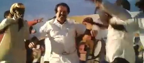 Video grab of former DMK minister K Ponmudi dancing with supporters at T Edaiyar village
