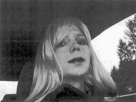 Chelsea Manning poses for a photo wearing a wig and lipstick. (File photo | AP)