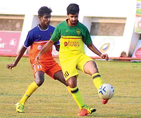 Nirmala College’s Ajith Shivan (left) and Baselius College’s Nidheesh in action during TNIE GOAL 2016  at Malappuram District Sports Council Stadium on Tuesday