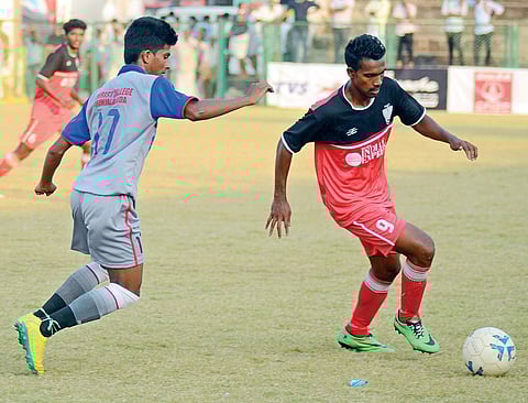 Christ College’s Libin Yohannan (left) and Sree Kerala Varma College’s Surjith V Ramesh in action during TNIE GOAL 2017 at the Malappuram District Sports Council Stadium on Wednesday