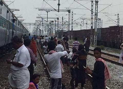Passengers headed to Tirupati stranded before Arakkaonam as their train is stopped due to Jallikattu protests. (By arrangement)