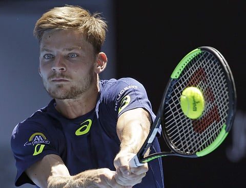 Belgium's David Goffin makes a backhand return to Croatia's Ivo Karlovic during their third round match at the Australian Open tennis championships in Melbourne.(Photo | AP)
