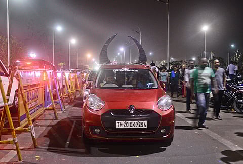 Raging bull: Makeshift horns on a red Renault Pulse car cruising through the main road along Marina beach send out a message in support of Jallikattu. Protestors demanding that the ban on the traditional bull-taming sport of Tamil Nadu be revoked have been camped out on the sands of the Marina Beach in Chennai for five days since Tuesday. The crowds have swelled and the peaceful protests have taken on colourful forms. (Shiba Prasad Sahu | EPS)