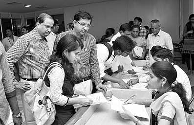 Students submitting passport applications at a programme at GITAM University in Vizag on Saturday | Express