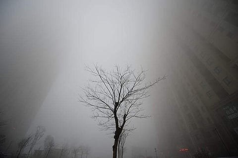 Buildings are seen in heavy smog during a polluted day in Jinan, Shandong province, China, December 20, 2016. REUTERS