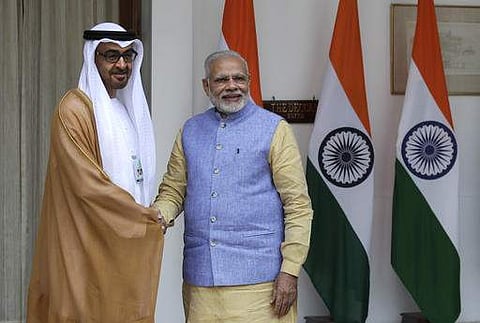 Indian Prime Minister Narendra Modi, right, shakes hand with Abu Dhabi's Crown Prince Sheikh Mohammed bin Zayed Al Nahyan before their delegation level meeting in New Delhi. | AP