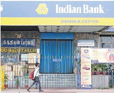 A man walking past a closed branch of the Indian Bank at Harbour, in Chennai | File Photo