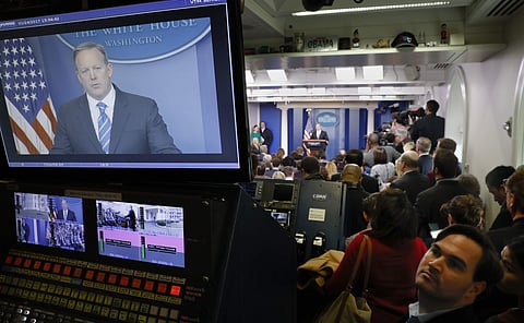 White House Press secretary Sean Spicer is seen on television broadcast monitors as he speaks to the media during the daily briefing in the Brady Press Briefing Room of the White House in Washington, Tuesday, Jan. 24, 2017. |AP