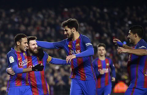 FC Barcelona's Lionel Messi, second left, celebrates with team mates after scoring a penalty during Copa del Rey, quarter final, second leg, soccer match between FC Barcelona and Real Sociedad at the Camp Nou in Barcelona, Spain, Thursday, Jan. 26, 2017. 