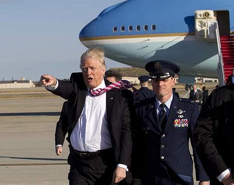 President Donald Trump walks on the tarmac as he waves to the crowd upon his arrival at Andrews Air Force Base, Md., Thursday, Jan. 26, 2017.  | AP