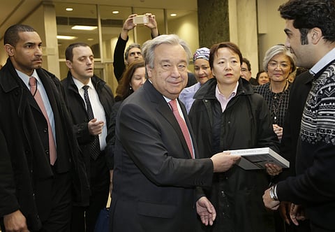 United Nations Secretary-General Antonio Guterres talks with people as he makes his way to a meeting with members of the U.N. staff at U.N. headquarters, Tuesday, Jan. 3, 2017. | AP