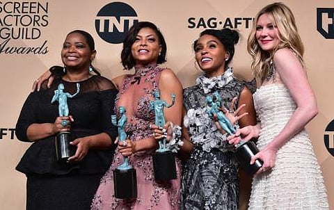 (L-R) Actors Octavia Spencer, Taraji P. Henson, Janelle Monae, and Kirsten Dunst, co-recipients of the Outstanding Performance by a Cast in a Motion Picture award for 'Hidden Figures,' during the 23rd Annual Screen Actors Guild Awards on January 29. (Phot
