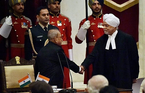 President Pranab Mukherjee greets the new Chief Justice of India Justice JS Khehar after administering the oath of office to him during a ceremony at Rashtrapati Bhavan in New Delhi on Thursday. | PTI