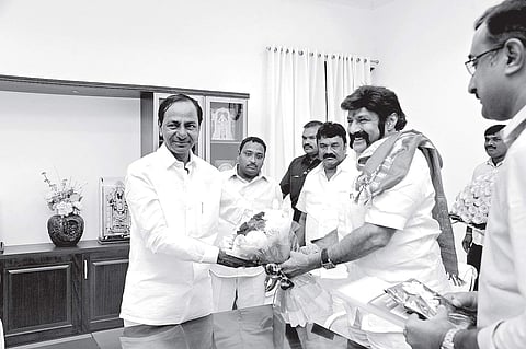 Tollywood actor Balakrishna presenting a bouquet to Chief Minister K Chandrasekhar Rao at Pragati Bhavan in Hyderabad on Friday | Express photo