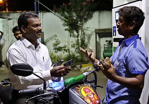 A customer haggles with a worker at a petrol pump in Chennai over mode of payment on Sunday | Romani Agarwal