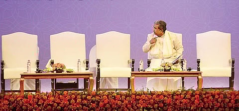 Chief Minister Siddaramaiah waits for delegates to join him on the dais for the inauguration of Pravasi Bharatiya Divas on Sunday | pushkar v