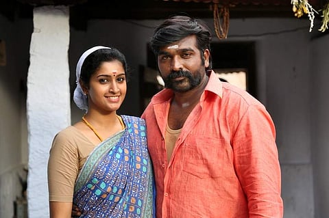 Vijay Sethupathi and Tanya Ravichandran in a still from 'Karuppan'.