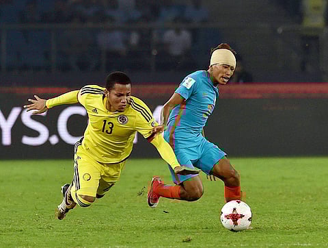 India's Boris Thangjam battles for the ball with Colombia's Robert Mejia during their FIFA U-17 World Cup 2017 football match in New Delhi on Monday.  The hosts were on the ball from the word go, despite more possesions from the Colombians. | PTI