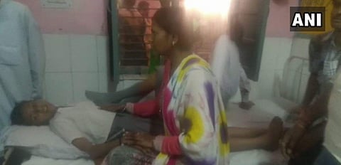 A woman with her child at the district hospital in Shamli district of UP. (ANI)