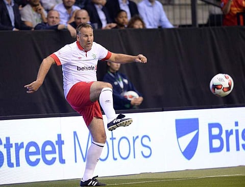 Former Arsenal midfielder Paul Merson | AFP