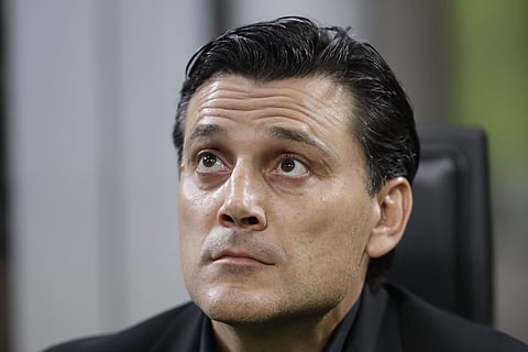 AC Milan head coach Vincenzo Montella looks up prior to the Europa League group D soccer match between AC Milan and Rijeka, at the Milan San Siro Stadium, Italy. | AP