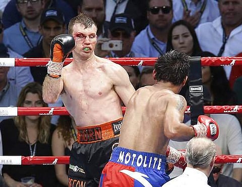 Jeff Horn, left, of Australia and Manny Pacquiao of the Philippines fight during their WBO World welterweight title bout in Brisbane. | AP