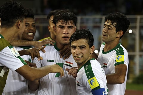 Iraq's teammates congratulate Mohammed Dawood for scoring a goal against Chile during the FIFA U-17 World Cup match in Kolkata, India, Wednesday, Oct. 11, 2017. | AP