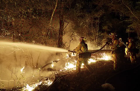 Fire crews battle a wildfire Saturday, Oct. 14, 2017, in Santa Rosa. | AP