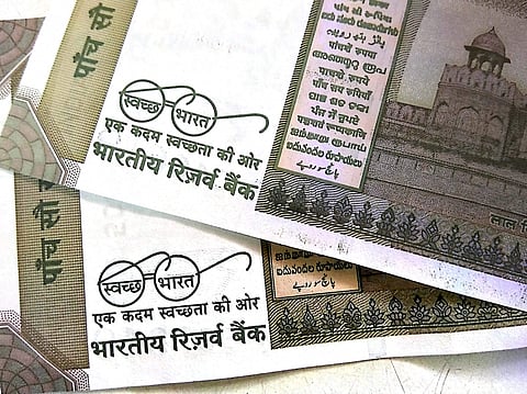 Photo of Rs 500 currency notes showing 'clean India mission' logo. | PTI