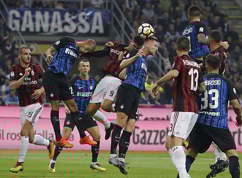 From left, AC Milan's Leonardo Bonucci, Inter Milan's Miranda, Inter Milan's Ivan Perisic, AC Milan's Andre Silva and Inter Milan's Milan Skriniar go for the ball during the Serie A soccer match. | AP