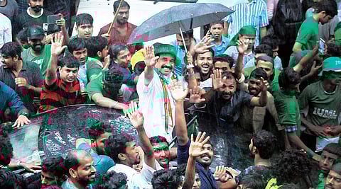 K N A Khader acknowledges supporters’ cheers outside the counting station after emerging as the winner | A Sanesh