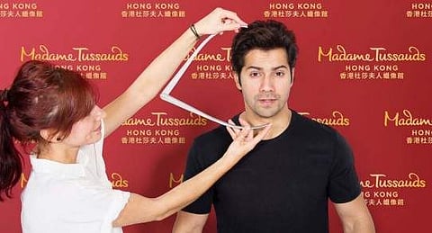 A group of skilled Madame Tussauds sculpting team specially travelled to Mumbai to meet Varun Dhawan and conduct a detailed sitting process. (Photo | Twitter)