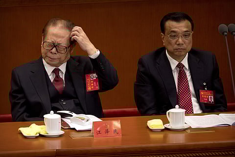 Former Chinese President Jiang Zemin, left, during the opening session of China's 19th Party Congress at the Great Hall of the People in Beijing, Wednesday, Oct. 18, 2017. | AP