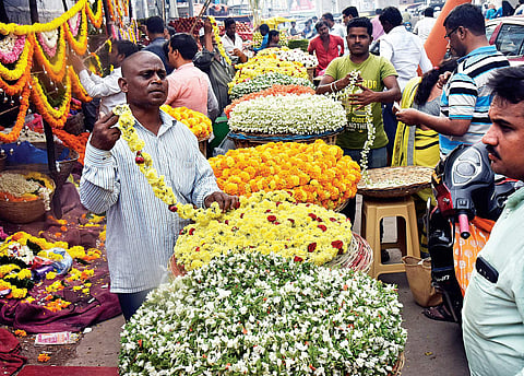 Flowers vendors at Moazzam Jahi Market in Hyderabad on Wednesday | Vinay Madapu