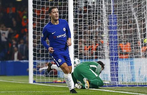Chelsea's Eden Hazard, left, celebrates after scoring during the Champions League group C soccer match against Roma. | AP