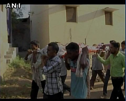 People carrying the deceased. (ANI Photo)