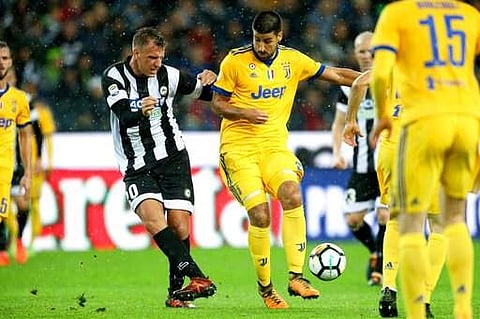 Udinese's Maxi Lopez, left, and Juventus' Sami Khedira vie for the ball during the Italian Serie A soccer match. | AP