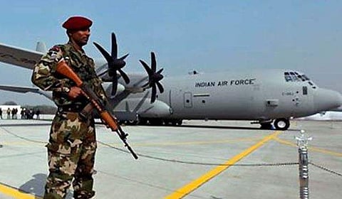 A Special Forces commando stands guard near the C-130J-30 Super Hercules aircraft at a ceremony at the Air Force Station at Hindon near New Delhi. AP Photo