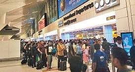 People wait for their turn at the IGI Airport for immigration formalities | Express