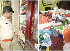 Police inspecting the house where H3 crore worth articles were robbed in Ongole on Monday | Express