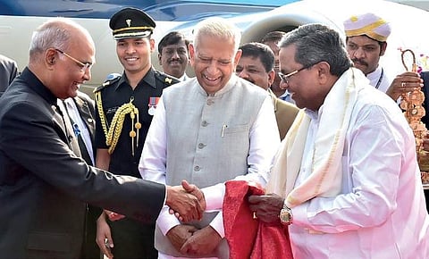 (From right) Chief Minister Siddaramaiah and Governor Vajubhai Vala receiving President Ram Nath Kovind at HAL airport in Bengaluru on Tuesday | Express